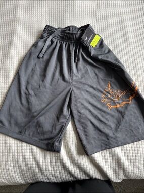 Brand New w tags Nike Boy’s Gray Athletic Shorts with Orange Graphic Accent
